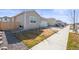 Single-Gathering home featuring an attached two-car garage, complemented by a well-kept front yard at 770 Twining Ave, Brighton, CO 80601