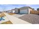 A single-Gathering home boasts a two-car garage, complemented by a well-maintained lawn at 770 Twining Ave, Brighton, CO 80601
