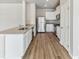 Bright kitchen features stainless steel appliances, granite countertops, and laminate flooring at 770 Twining Ave, Brighton, CO 80601