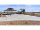 Community playground featuring a covered picnic area, play structure, and recreational amenities for outdoor enjoyment at 770 Twining Ave, Brighton, CO 80601