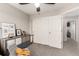 Bedroom featuring a double closet with sliding doors and neutral-toned walls at 4873 S Fultondale Way, Aurora, CO 80016