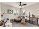 Charming bedroom featuring a ceiling fan, and decorative shelving, perfect for a room at 4873 S Fultondale Way, Aurora, CO 80016