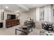Relaxing living room space with modern furniture, a TV, and natural light at 4873 S Fultondale Way, Aurora, CO 80016