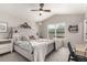 Main bedroom with carpet, vaulted ceiling, and large windows provide ample natural light at 4873 S Fultondale Way, Aurora, CO 80016