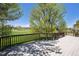 Relax on the deck, enjoying panoramic views of lush greenery and fairways at 1105 Oakhurst Dr, Broomfield, CO 80020