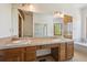 Bright primary bathroom featuring a double sink vanity, soaking tub, and walk-in shower at 1105 Oakhurst Dr, Broomfield, CO 80020