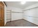 Spacious walk-in closet with carpet floors, shelving, and a light to keep everything organized at 1105 Oakhurst Dr, Broomfield, CO 80020