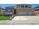 Charming two-story brick home with a spacious driveway and attached two-car garage, perfect for Gathering living at 1105 Oakhurst Dr, Broomfield, CO 80020