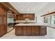 Spacious kitchen featuring stainless steel appliances, a large island, and ample counter space, perfect for culinary enthusiasts at 1105 Oakhurst Dr, Broomfield, CO 80020