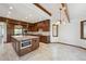 Gourmet kitchen with stainless steel appliances, a center island, and custom cabinetry, perfect for cooking at 1105 Oakhurst Dr, Broomfield, CO 80020