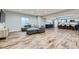 Finished basement featuring a cozy seating area and a modern kitchen with a spacious island at 25 N Irvington St, Aurora, CO 80018