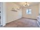 Bright bedroom with neutral walls, a window, and minimalist decor at 25 N Irvington St, Aurora, CO 80018