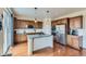 Modern kitchen featuring stainless steel appliances, granite countertops, and hardwood floors at 25 N Irvington St, Aurora, CO 80018