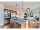 Modern kitchen with granite island and stainless appliances overlooking the living room at 25 N Irvington St, Aurora, CO 80018