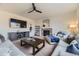 Spacious living room featuring a fireplace, large television, and comfortable seating at 25 N Irvington St, Aurora, CO 80018