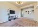 Versatile living space with a television and ample shelving for storage and decor at 25 N Irvington St, Aurora, CO 80018