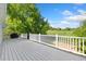 Large back deck overlooking manicured lawn at 2251 Cliffrose Ln, Louisville, CO 80027