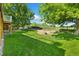 Lush backyard with green lawn and landscaping, perfect for enjoying the outdoors and entertaining guests at 2251 Cliffrose Ln, Louisville, CO 80027