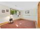 Finished basement with a large window for natural light, neutral paint and carpeting at 2251 Cliffrose Ln, Louisville, CO 80027