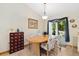 Bright dining area with tile flooring and a sliding door to the outdoor deck at 2251 Cliffrose Ln, Louisville, CO 80027