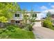 Charming home with a well-manicured lawn, mature landscaping, and a welcoming exterior at 2251 Cliffrose Ln, Louisville, CO 80027