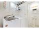 Bright laundry room with newer appliances and small sink at 2251 Cliffrose Ln, Louisville, CO 80027