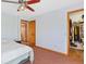 A spacious bedroom with a large closet and direct access to another room at 2251 Cliffrose Ln, Louisville, CO 80027