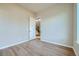 Bedroom features modern flooring, neutral paint, and access to the stairway at 681 Harness St, Erie, CO 80516