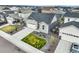 Aerial view of a well-maintained single-Gathering home with a two-car garage and manicured lawn at 2144 Coyote Mint Dr, Monument, CO 80132