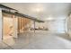 Large unfinished basement with concrete floors, exposed beams, and a framed stairwell to the main floor at 2144 Coyote Mint Dr, Monument, CO 80132