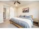 Bedroom with modern sliding closet door, neutral walls, and stylish furnishings at 2144 Coyote Mint Dr, Monument, CO 80132