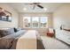 Well-lit bedroom with large windows, modern decor, and comfortable furnishings at 2144 Coyote Mint Dr, Monument, CO 80132