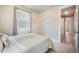 Bright bedroom featuring a cozy bed, soft carpet, and a window with light-filtering curtains at 2144 Coyote Mint Dr, Monument, CO 80132