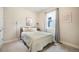 Bedroom with neutral colors, with natural light, and matching sconces next to the bed at 2144 Coyote Mint Dr, Monument, CO 80132