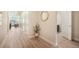 Inviting hallway featuring wood floors, stylish decor, and seamless transition to the living spaces at 2144 Coyote Mint Dr, Monument, CO 80132