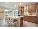 Bright kitchen boasts stainless appliances, a large center island with seating, and sleek countertops at 2144 Coyote Mint Dr, Monument, CO 80132