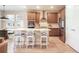 Kitchen view showcases stainless appliances, counter seating, and a bright, open layout at 2144 Coyote Mint Dr, Monument, CO 80132