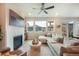 Bright living room featuring a fireplace, comfortable seating, and sliding doors to the outdoor space at 2144 Coyote Mint Dr, Monument, CO 80132