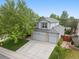 Beautiful aerial view of a two-story home with mature trees and spacious driveway at 4982 S Danube St, Aurora, CO 80015