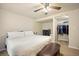 Spacious bedroom with a bed, dark wood furniture and walk in closet at 4982 S Danube St, Aurora, CO 80015