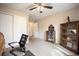 Bedroom with neutral walls, carpet, closet, overhead fan, and furnishings at 4982 S Danube St, Aurora, CO 80015