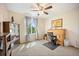 Bedroom with neutral walls, carpet, window, overhead fan, and furnishings at 4982 S Danube St, Aurora, CO 80015
