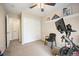 Neutral bedroom featuring carpeting, a ceiling fan and sliding closet doors at 4982 S Danube St, Aurora, CO 80015