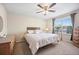 Bright bedroom with neutral walls, carpet, window, overhead fan, and furnishings at 4982 S Danube St, Aurora, CO 80015
