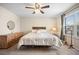 Bright bedroom with neutral walls, carpet, window, overhead fan, and furnishings at 4982 S Danube St, Aurora, CO 80015