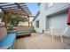 Inviting deck features built-in seating, pergola, and outdoor dining area, ideal for relaxing or entertaining at 4982 S Danube St, Aurora, CO 80015