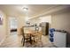 Basement dining area with table and chairs next to the kitchenette at 4982 S Danube St, Aurora, CO 80015