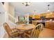 Bright dining room next to the kitchen provides an airy flow for easy entertaining at 4982 S Danube St, Aurora, CO 80015