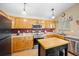 Functional kitchen with stainless steel appliances and ample cabinet space at 4982 S Danube St, Aurora, CO 80015