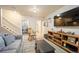 Cozy living room with a comfortable gray sofa and entertainment center at 4982 S Danube St, Aurora, CO 80015